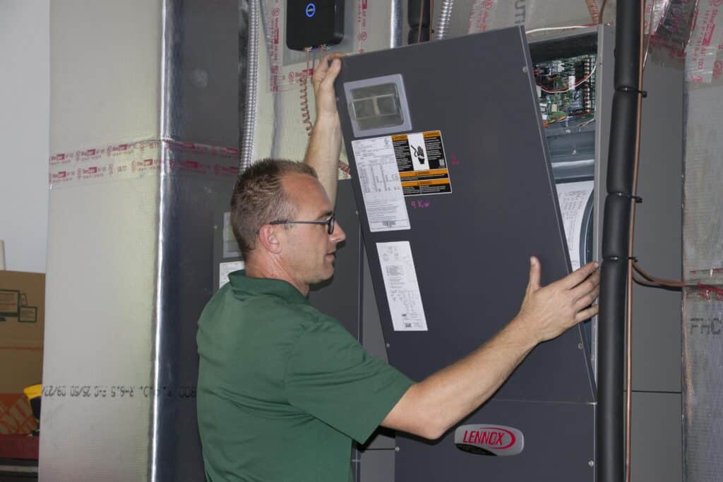 A technician about to check the Air conditioner