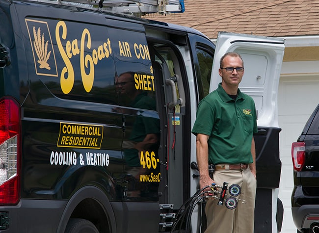 An AC technician preparing equipments