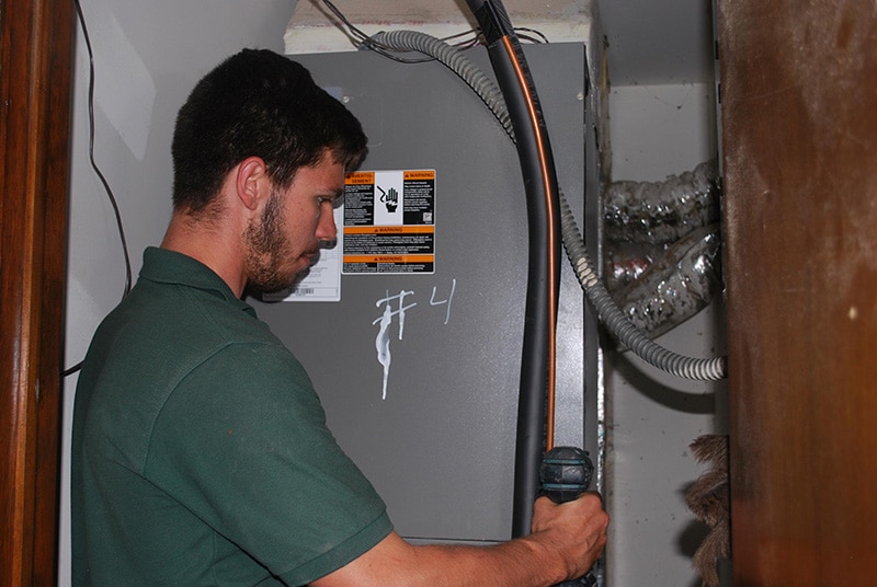 A technician doing heater repair